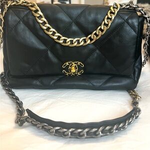 Black quilted flap bag .